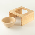 Ciotola in ceramica crema con supporto in legno – 14 cm
